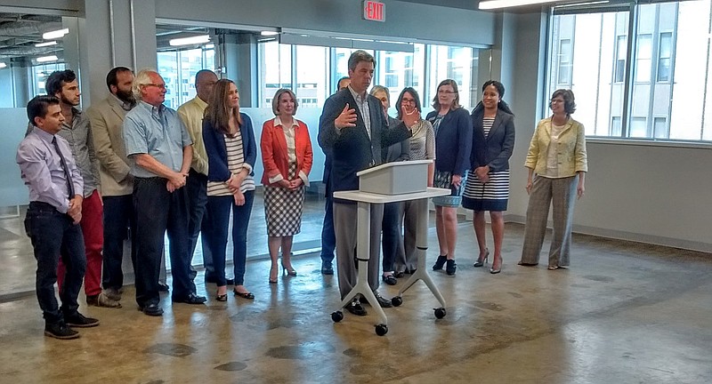 Chattanooga Mayor Andy Berke (at podium) speaks Wednesday afternoon on the fifth floor of the Edney Building at 11th and Market streets about his new Family Friendly Workplace Challenge flanked by representatives of various local businesses and institutions.• Blue Cross Blue Shield of Tennessee• The Bread Basket• The Company Lab (CO.LAB)• The Chattanooga Area Chamber of Commerce• Chattanooga State Community College• EPB• Epiphany Day Spa & Brow Couture• Ovalle's Catering Company• The University of Chattanooga at Tennessee• CO.STARTERSSource: City of Chattanooga