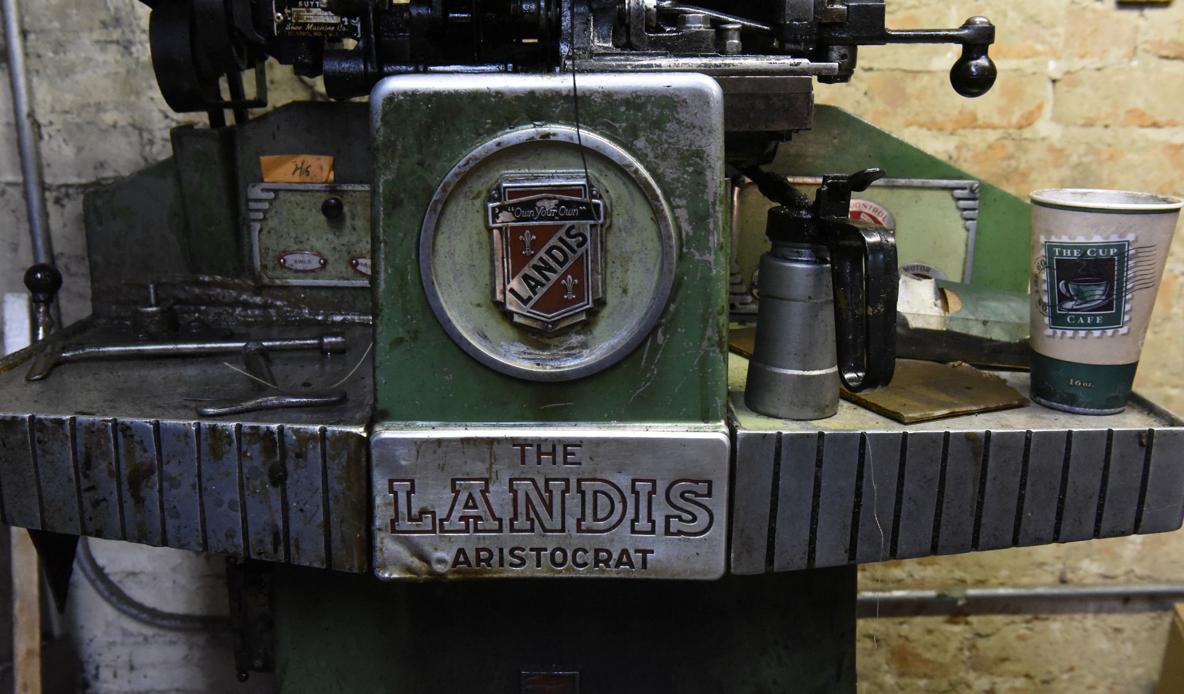 One of Reginald Cousin's vintage shoe repair machines is seen in his shoe repair business, Kenton Shoe Shop, located at the corner of Broad and Eighth Streets Wednesday, Apr. 27, 2016, in Chattanooga, Tenn. A new building owner is remodeling, and Cousin, age 73, is closing his shop, the last shoe repair business in the downtown area.