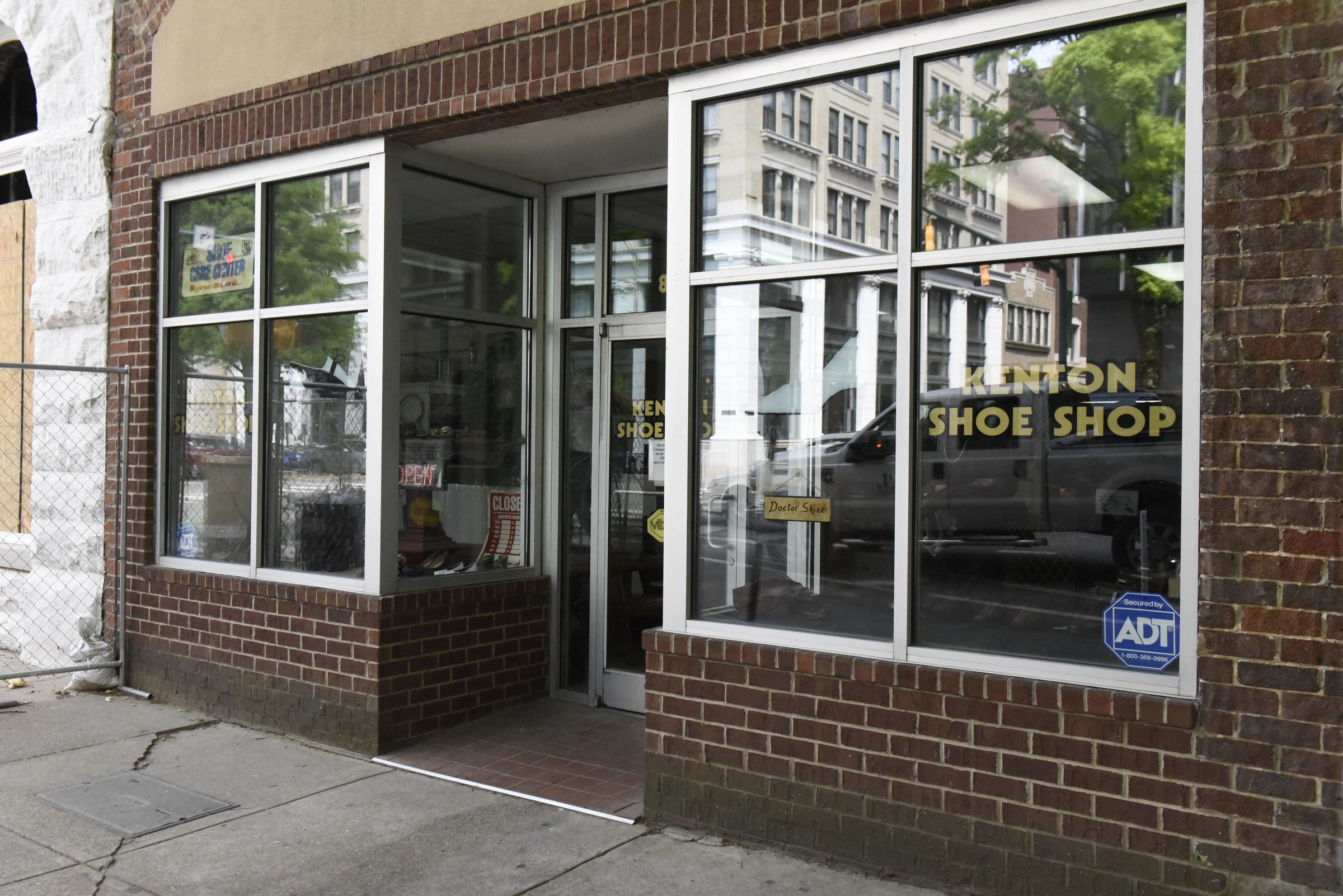The Kenton Shoe Shop is located at the corner of Broad and Eighth Streets Wednesday, Apr. 27, 2016, in Chattanooga, Tenn. A new building owner is remodeling, and Reginald Cousin, age 73, is closing his shop, the last shoe repair business in the downtown area.