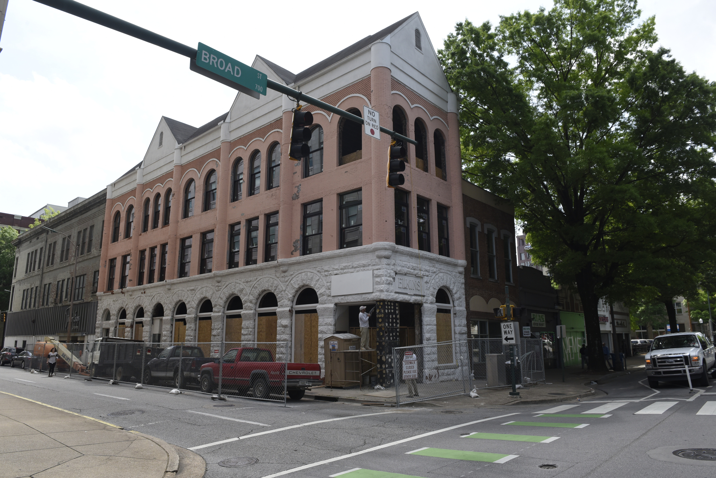 The Elkins building adjoins the Kenton Shoe Shop, located at the corner of Broad and Eighth Streets Wednesday, Apr. 27, 2016, in Chattanooga, Tenn. A new building owner is remodeling, and Reginald Cousin, age 73, is closing his shop, the last shoe repair business in the downtown area.