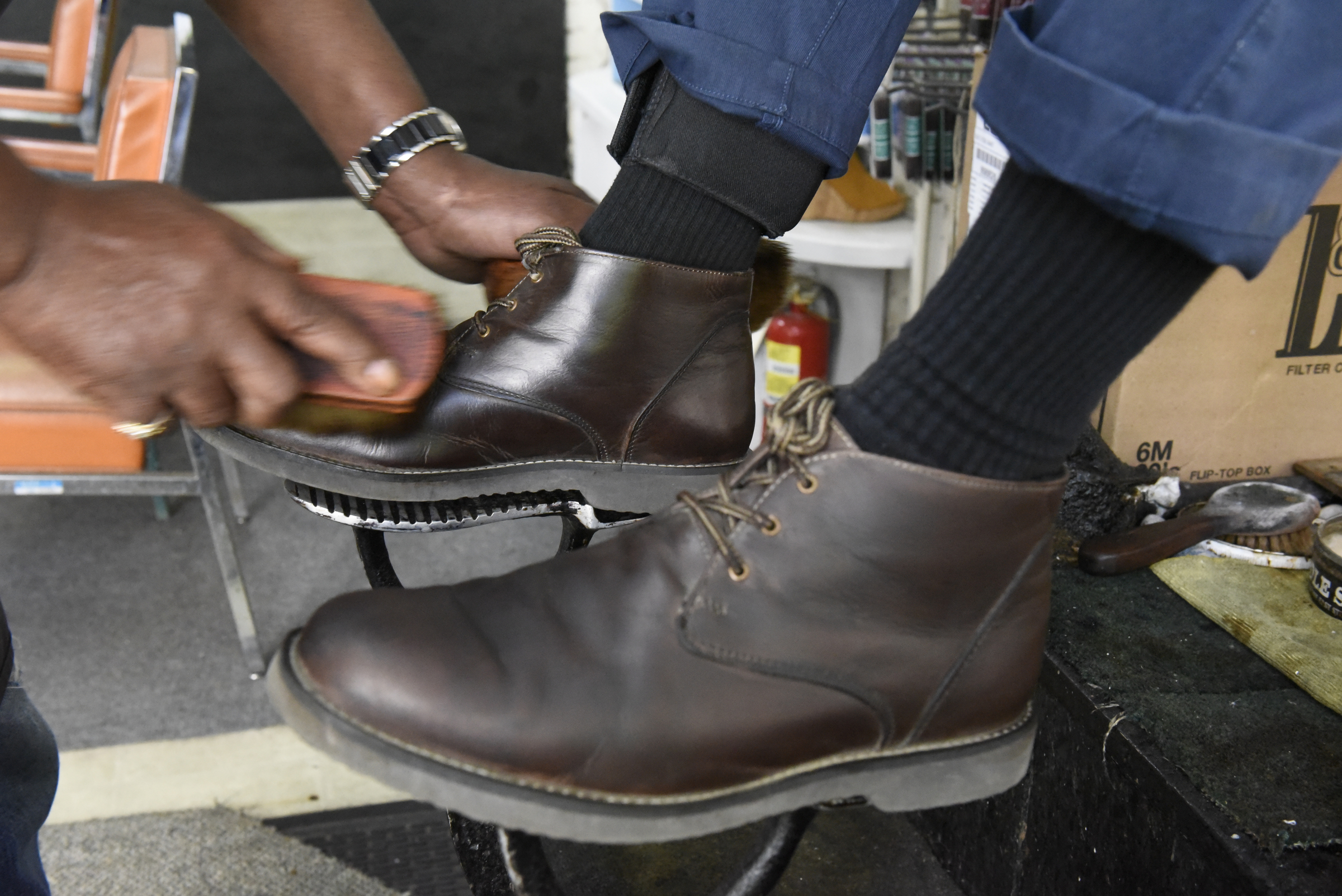 Arthur Ballinger, also known as "Dr. Shine", polishes shoes at Kenton Shoe Shop, located at the corner of Broad and Eighth Streets Wednesday, Apr. 27, 2016, in Chattanooga, Tenn. Ballinger hopes to keep shining shoes downtown after Reginald Cousin closes the shoe shop.