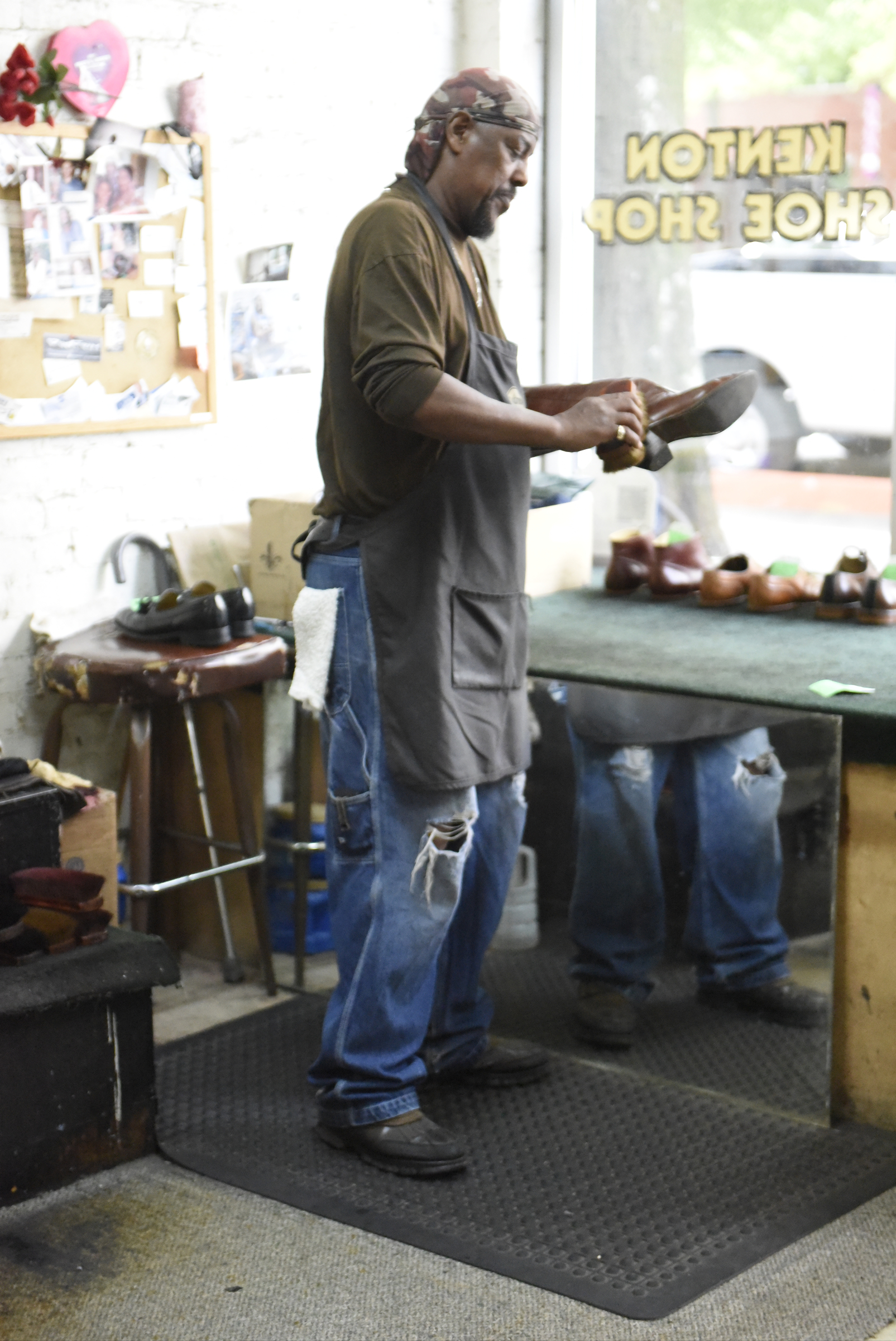 Arthur Ballinger, also known as "Dr. Shine", polishes shoes at Kenton Shoe Shop, located at the corner of Broad and Eighth Streets Wednesday, Apr. 27, 2016, in Chattanooga, Tenn. Ballinger hopes to keep shining shoes downtown after Reginald Cousin closes the shoe shop.