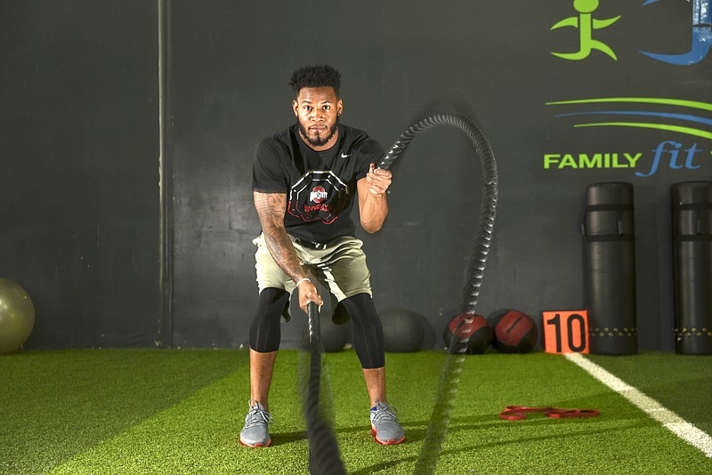 Vonn Bell works out with battle ropes at Tobe Taylor Fitness in hopes of being drafted by the NFL.