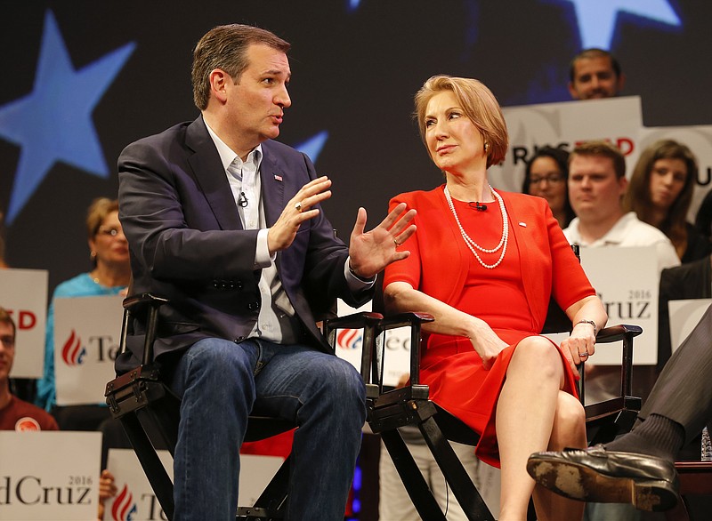 In this photo taken March 11, 2016, Republican presidential candidate, Sen. Ted Cruz, R-Texas speaks to Carly Fiorina in Orlando, Fla., Friday, March 11, 2016. According to an AP source, Cruz has picked Fiorina as his running mate.