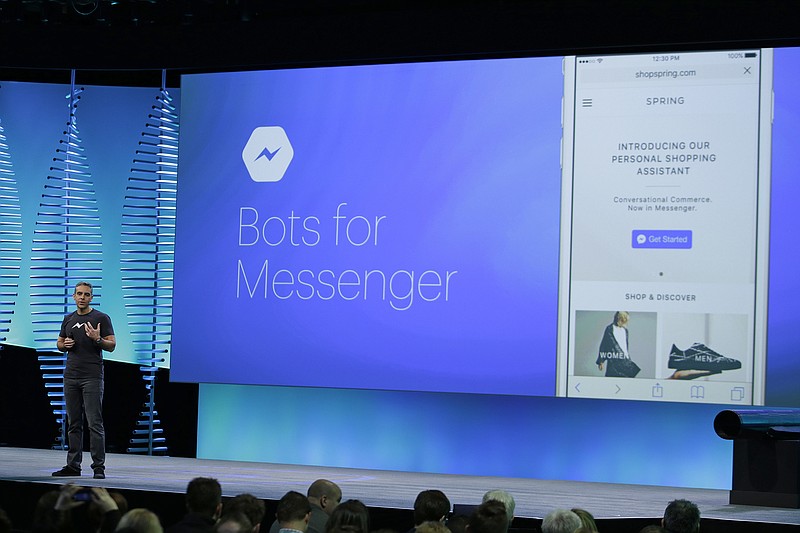 FILE - In this April 12, 2016, file photo, David Marcus, Facebook Vice President of Messaging Products, talks about Bots for Messenger during the keynote address at the F8 Facebook Developer Conference in San Francisco. Facebook says people who use its Messenger chat service will soon be able to order flowers, request news articles and talk with businesses by using messaging bots. (AP Photo/Eric Risberg, File)