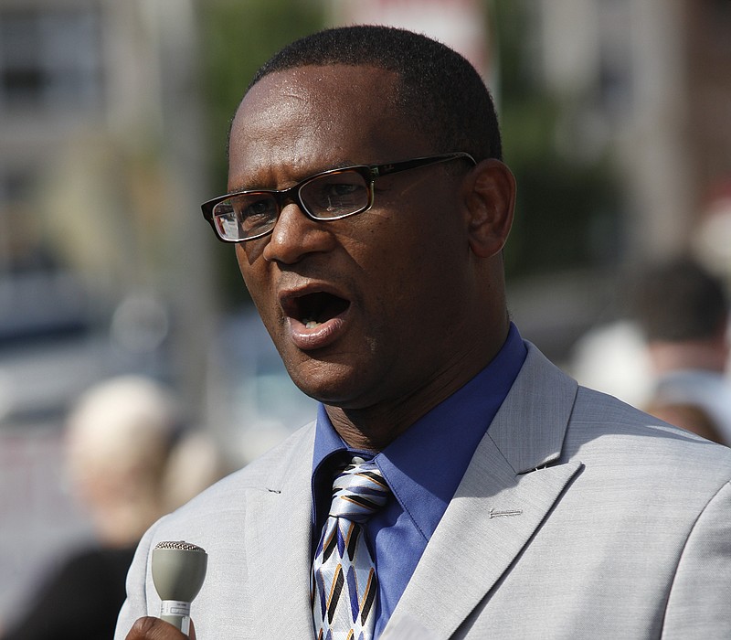 Kevin Muhammad, a minister of the Nation of Islam, speaks during a rally at Miller Park in Chattanooga.