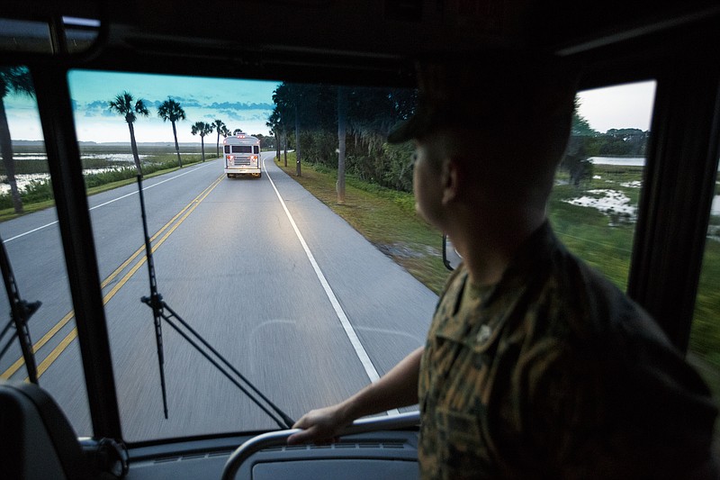 Staff photo by Doug Strickland / Sgt. Joseph Garcia looks out the windshield of the bus of educators as they arrive at the Marine Corps Recruit Depot on the 1st day of the Marine Corps Educators' Workshop on Wednesday, April 27, 2016, in Parris Island, South Carolina. Educators are given the opportunity to experience life as a marine corps recruit in boot camp during the 3-day workshop.