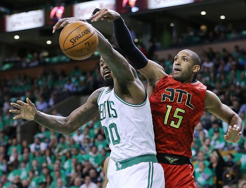 
              Atlanta Hawks center Al Horford knocks a rebound away from Boston Celtics forward Amir Johnson during the first half in Game 6 of a first-round NBA basketball playoff series Thursday, April 28, 2016, in Boston.  (Curtis Compton/Atlanta Journal-Constitution via AP)  MARIETTA DAILY OUT; GWINNETT DAILY POST OUT; LOCAL TELEVISION OUT; WXIA-TV OUT; WGCL-TV OUT; MANDATORY CREDIT
            