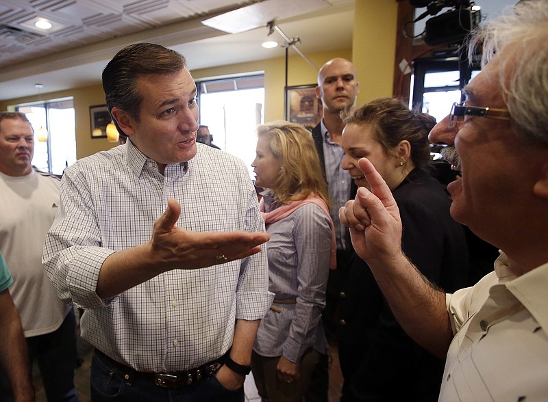 
              Republican presidential candidate, Sen. Ted Cruz, R-Texas speaks with Dimitri Adamopoulos during a campaign stop at Sister's Place Restaurant Wednesday, April 27, 2016, in Indianapolis. (AP Photo/Darron Cummings)
            