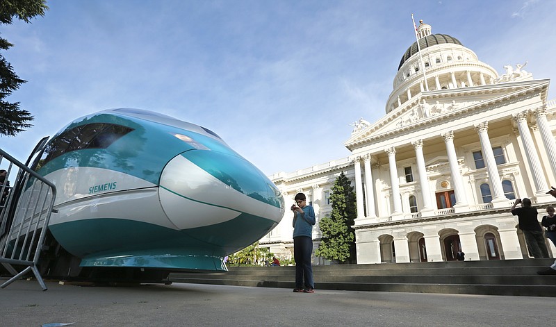 
              FILE - In this Feb. 26, 2015 file photo, a full-scale mock-up of a high-speed train is displayed at the Capitol in Sacramento, Calif. The board that oversees California’s massive high-speed rail project is meeting in Sacramento on Thursday afternoon, April 28, 2016, to consider a new $64 billion business plan. The updated plan calls for a station in Merced and the first stretch to go from the Central Valley to the San Jose area. (AP Photo/Rich Pedroncelli, File)
            