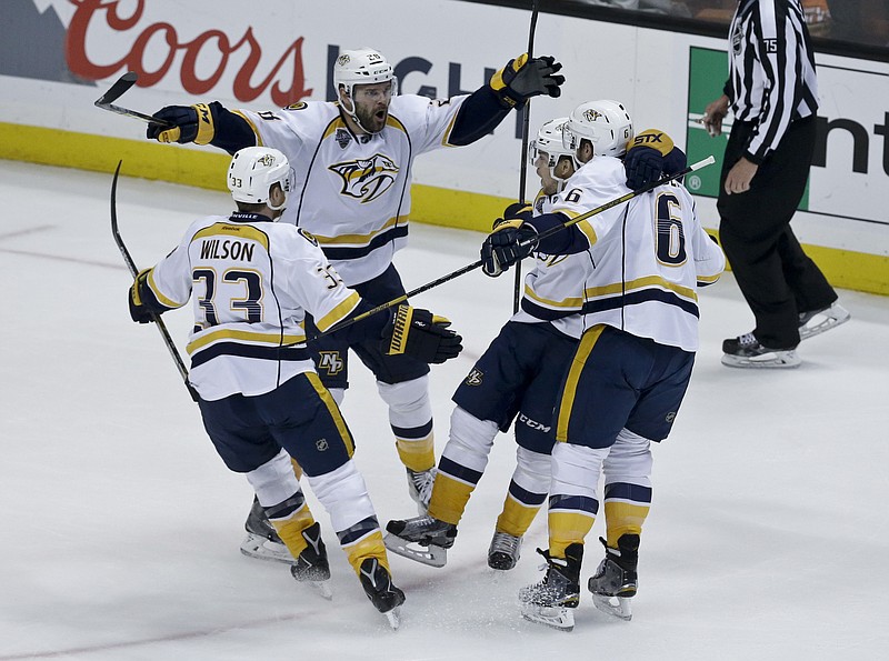 Nashville Predators center Paul Gaustad (28) celebrates with teammates after scoring during the first period of Game 7 in an NHL hockey Stanley Cup playoffs first-round series against the Anaheim Ducks in Anaheim, Calif., Wednesday, April 27, 2016. (AP Photo/Chris Carlson)
