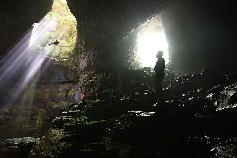 Experienced vertical rope riders may enter by the waterfall, at left inside Stephens Cap Cave in Jackson County, Ala. Spelunkers may walk in, at right. 