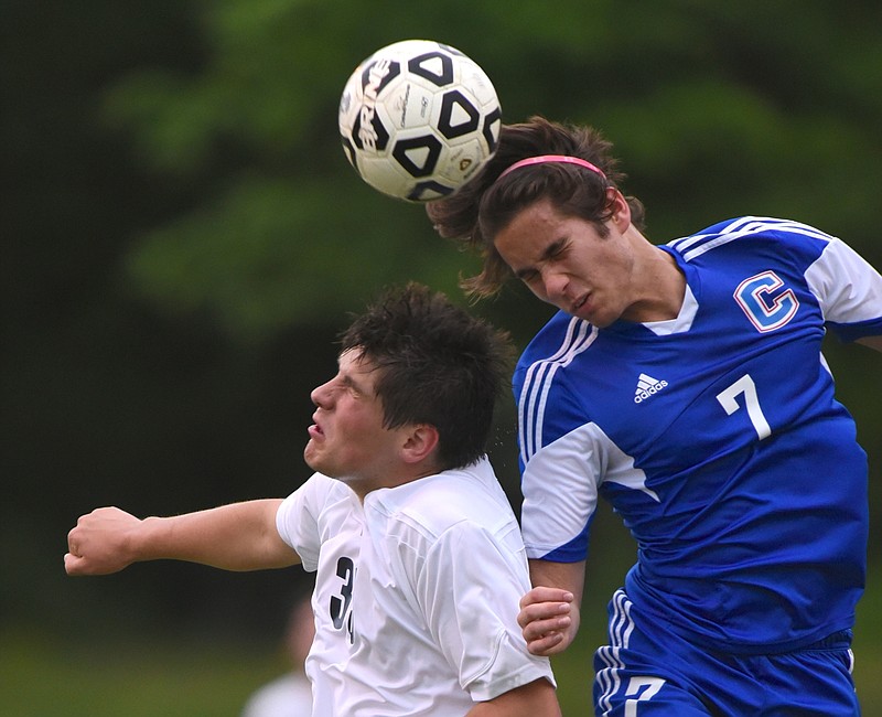 Cleveland's Pietro Miragoli, right, and CSAS's Michael Hicks compete for a header during a soccer game Friday at the North River Soccer Complex.