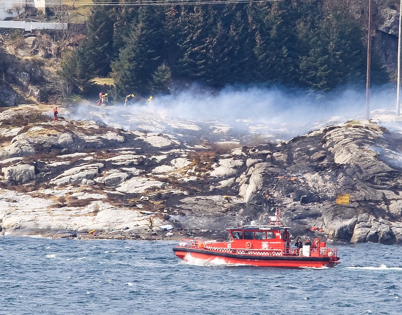 
              A search and rescue vessel patrols off the coast of the island of Turoey, near Bergen, Norway, as emergency workers attend the scene after a helicopter crashed believed to be have 13 people aboard, Friday April 29, 2016.  A helicopter carrying around 13 people from an offshore oil field crashed Friday near the western Norwegian city of Bergen, police said. Many are feared dead.  (Rune Nielsen / NTB scanpix via AP) NORWAY OUT
            