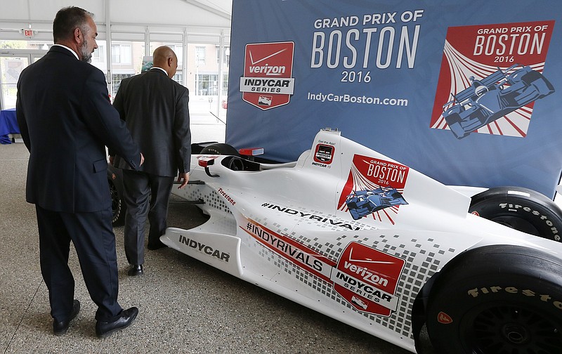 
              FILE - In this May 21, 2015, file photo, City of Boston chief of economic development John Barros, right, and tourism, sports and entertainment director Ken Brissette, left, examine an IndyCar mockup following a news conference in Boston announcing the inaugural Grand Prix of Boston scheduled for 2016. Organizers of the race, which had been planned for Labor Day weekend this year and again each year through 2020, told the open wheel circuit Friday, April 29, 2016, that they have scratched plans to bring a race to the city. (AP Photo/Michael Dwyer, File)
            