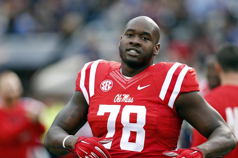 
              FILE - In this Oct. 24, 2015 file photo, Mississippi offensive lineman Laremy Tunsil (78) loosens up prior to his team's NCAA college football game against Texas A&M in Oxford, Miss. Mississippi will investigate former offensive lineman Laremy Tunsil's comments that he accepted money from a member of the football staff while playing at the school. The university said in a statement Friday, April 29, 2016, it is "aware of the reports from the NFL Draft regarding Laremy Tunsil and potential NCAA violations during his time at Ole Miss" and "will aggressively investigate and fully cooperate with the NCAA and the SEC." Tunsil was selected 13th overall Thursday night in the NFL draft by the Miami Dolphins (AP Photo/Rogelio V. Solis, File)
            
