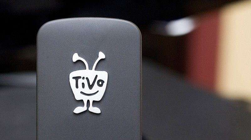 
              FILE - In this file photo taken March 1, 2010, a TiVo Wireless N Adapter is displayed in New York.  Digital TV listing company Rovi is buying TiVo in a cash-and-stock deal valued at about $1.1 billion. Rovi Corp. said Friday, April 29, 2016  that it will pay $10.70 in cash and stock for each TiVo Inc. share. Rovi will pay $2.75 per share in cash, or about $277 million. The rest, $7.95 per share, will be paid in stock.(AP Photo/Mark Lennihan, File)
            