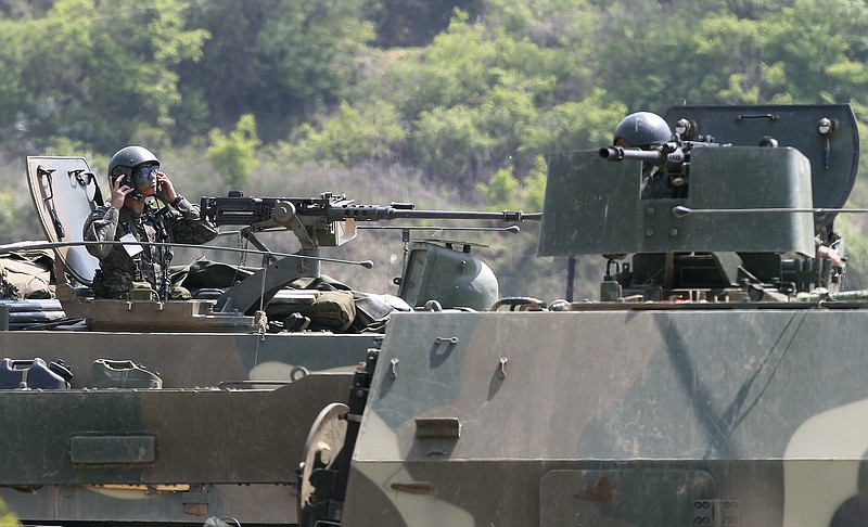 
              A South Korean army soldier mans a K-9 self-propelled artillery vehicle during an exercise in Paju, near the border with North Korea, South Korea, Friday, April 29, 2016. North Korea on Friday accused U.S. soldiers of trying to provoke its frontline troops with "disgusting" acts and encouraging South Korean soldiers to aim their guns at the North.(AP Photo/Ahn Young-joon)
            