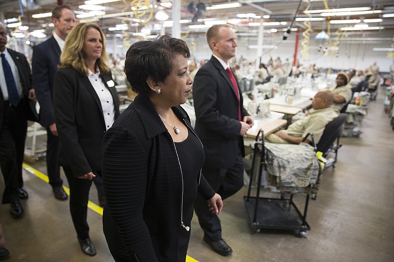Attorney General Loretta Lynch tours a factory where inmates work during a visit to the Talladega Federal Correctional Institution in Talladega, Ala., Friday, April 29, 2016, to highlight policies that aim to reduce barriers for formerly incarcerated individuals.