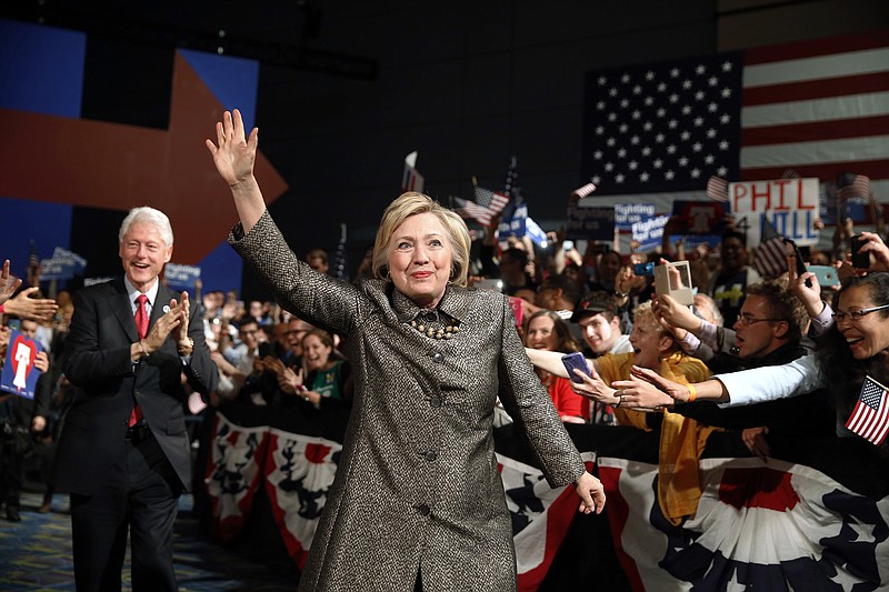
              FILE - In this April 26, 2016 file photo, Democratic presidential candidate Hillary Clinton, accompanied by former President Bill Clinton walks to stage at her presidential primary election night rally in Philadelphia. (AP Photo/Matt Rourke, File)
            