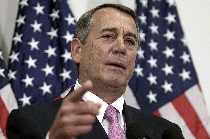 In this Oct. 27, 2015, file photo, then-House Speaker John Boehner of Ohio talks with reporters on Capitol Hill in Washington.