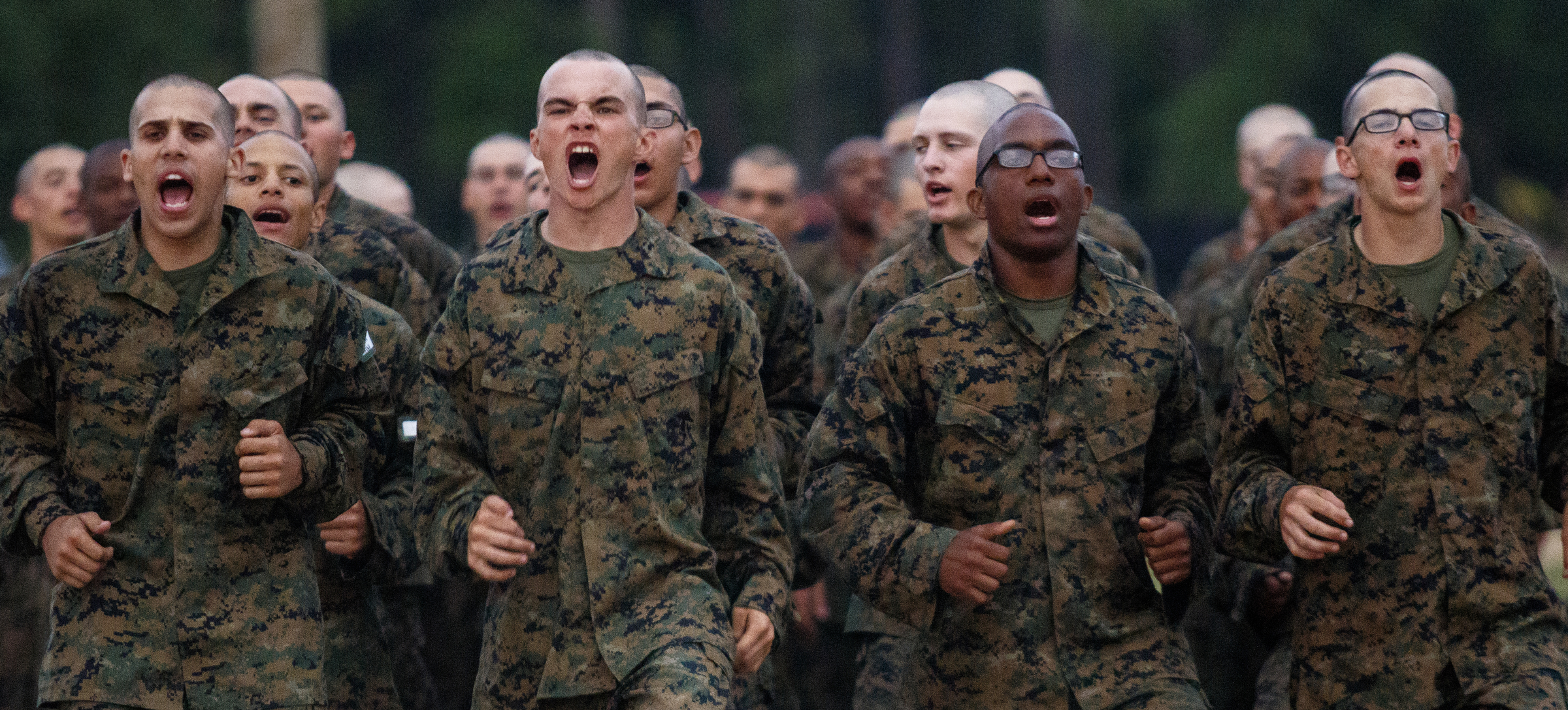 Recruits shout as they go through morning PT at the Marine Corps Recruit Depot on Thursday, April 28, 2016, in Parris Island, South Carolina.