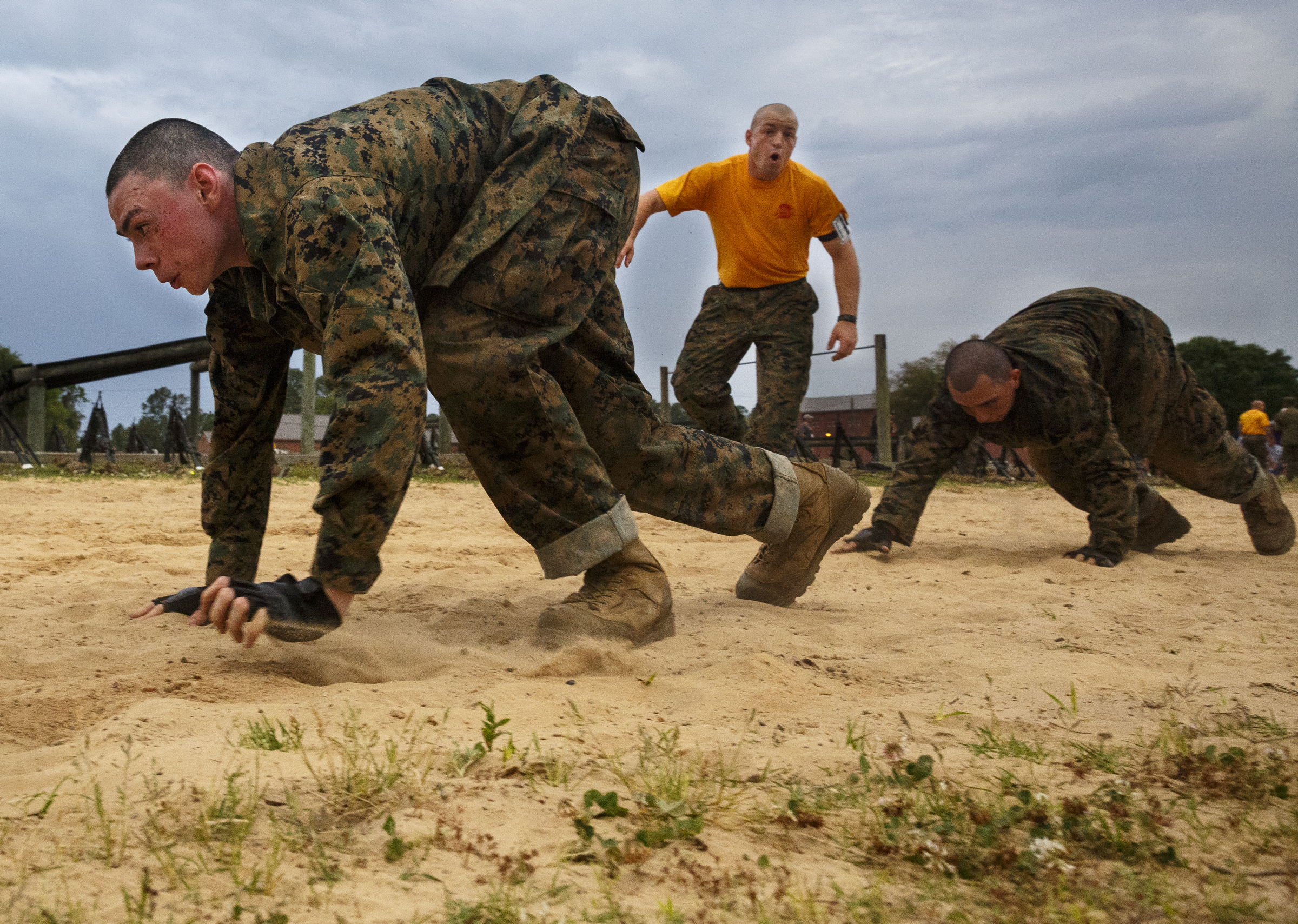 Marine recruits perform bear crawls as they go through morning PT at the Marine Corps Recruit Depot on Thursday, April 28, 2016, in Parris Island, South Carolina.