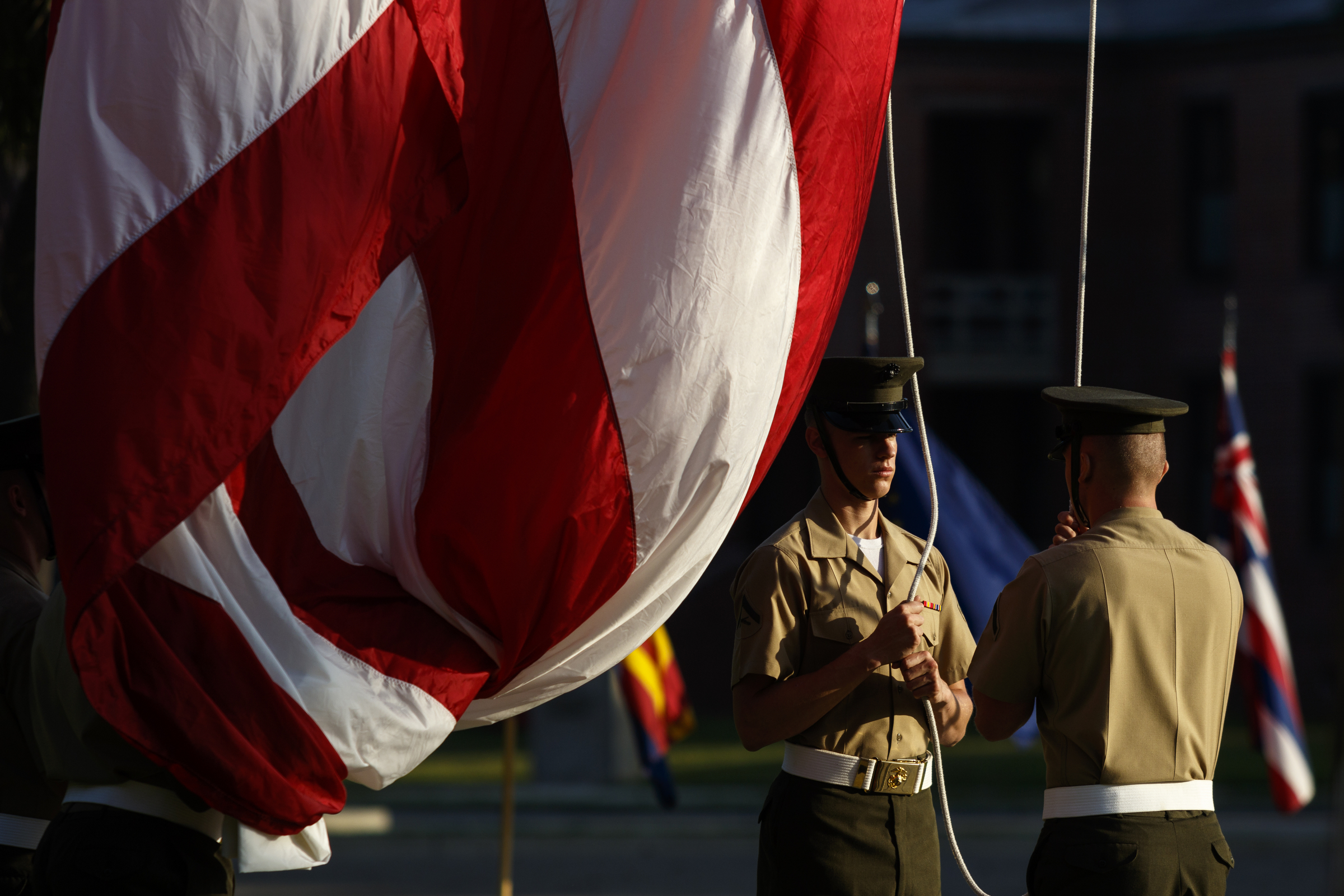 Marines raise the U.S. flag during the morning flag ceremony at the Marine Corps Recruit Depot on Friday, April 29, 2016, in Parris Island, South Carolina. 379 new Marines graduated from boot camp Friday.