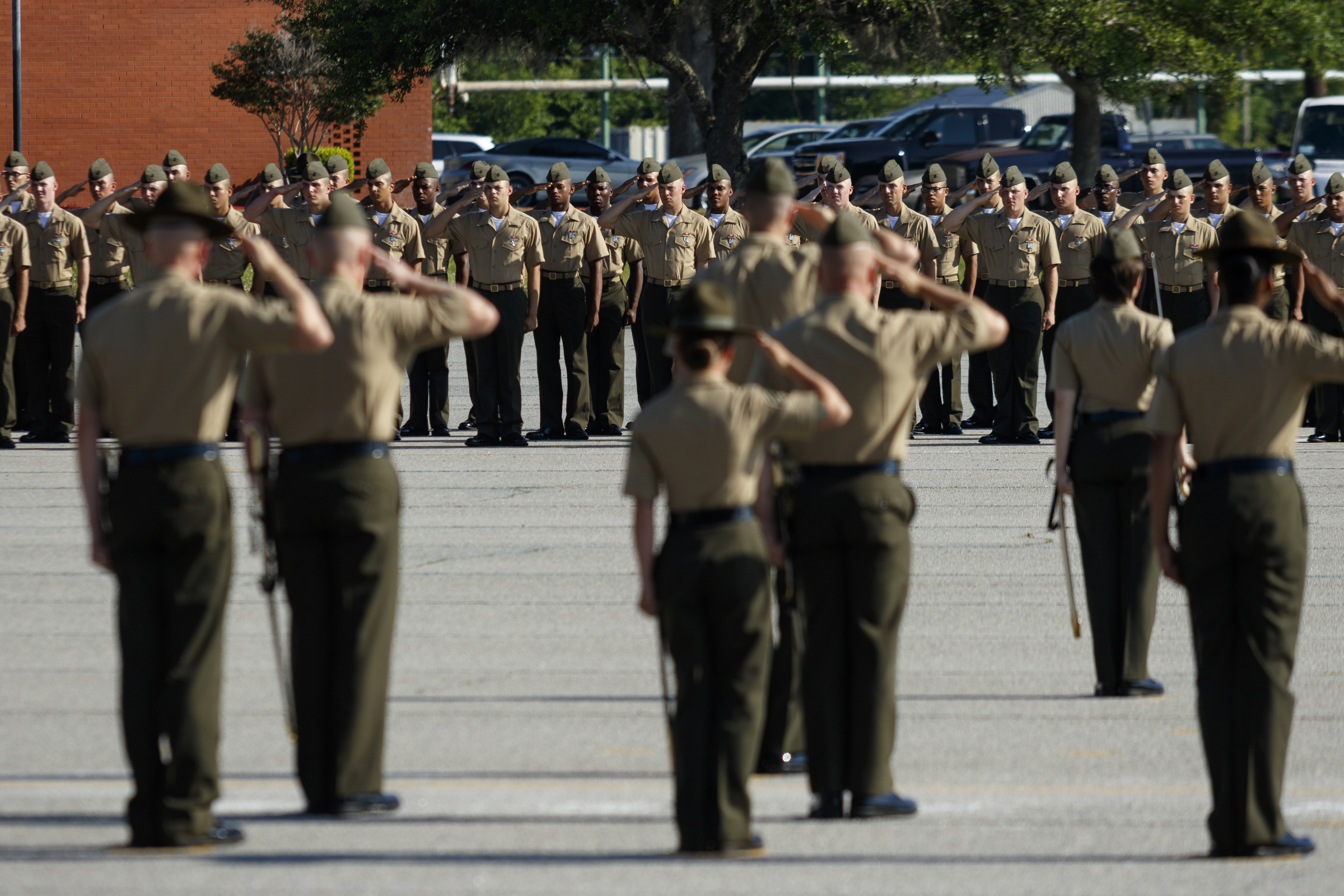 Marines salute during a graduation ceremony for new Marines at the Marine Corps Recruit Depot on Friday, April 29, 2016, in Parris Island, South Carolina. 379 new Marines graduated from boot camp Friday.