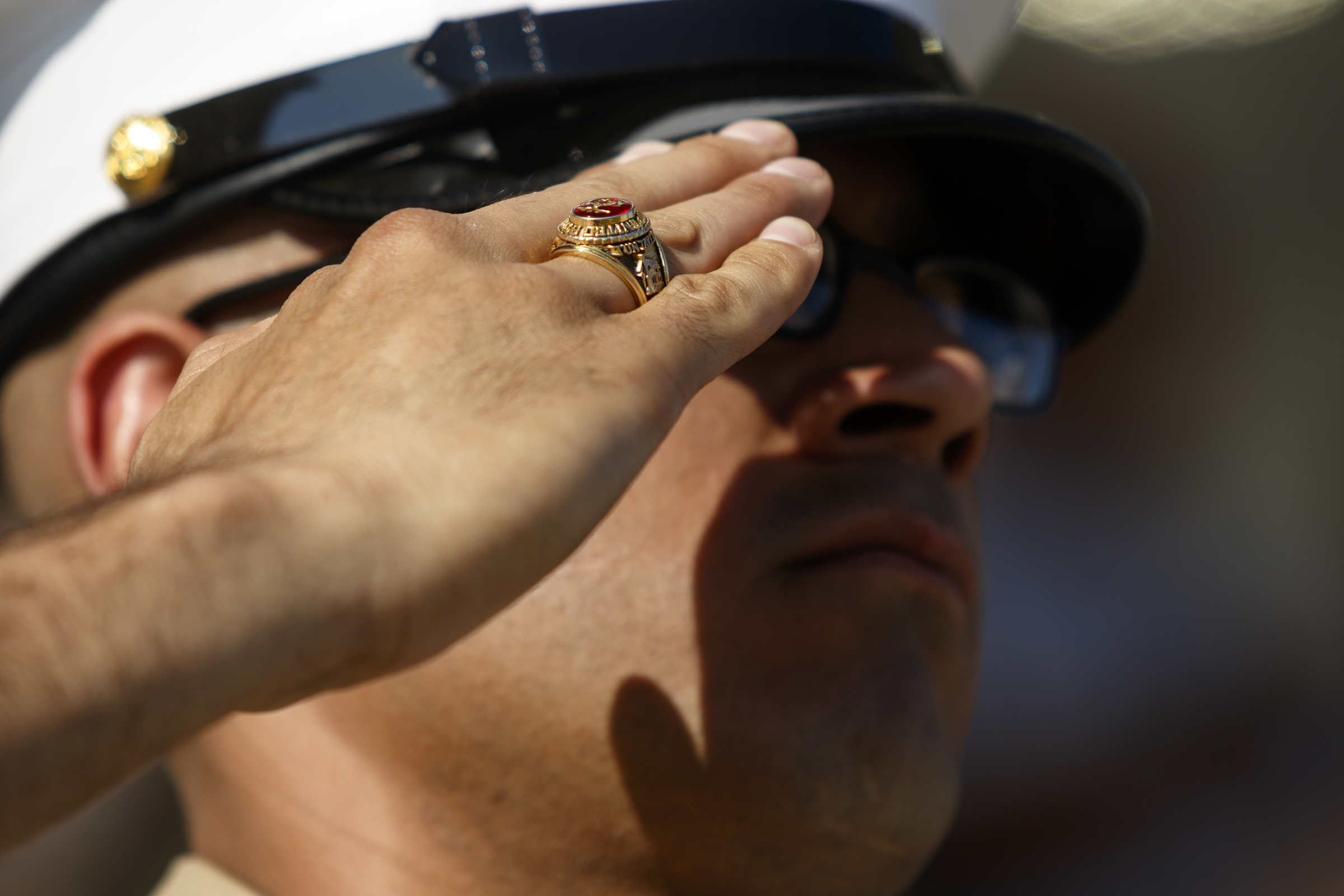 Staff Sgt. Garza salutes wearing a Marine Corps ring during a graduation ceremony for new Marines at the Marine Corps Recruit Depot on Friday, April 29, 2016, in Parris Island, South Carolina. 379 new Marines graduated from boot camp Friday.
