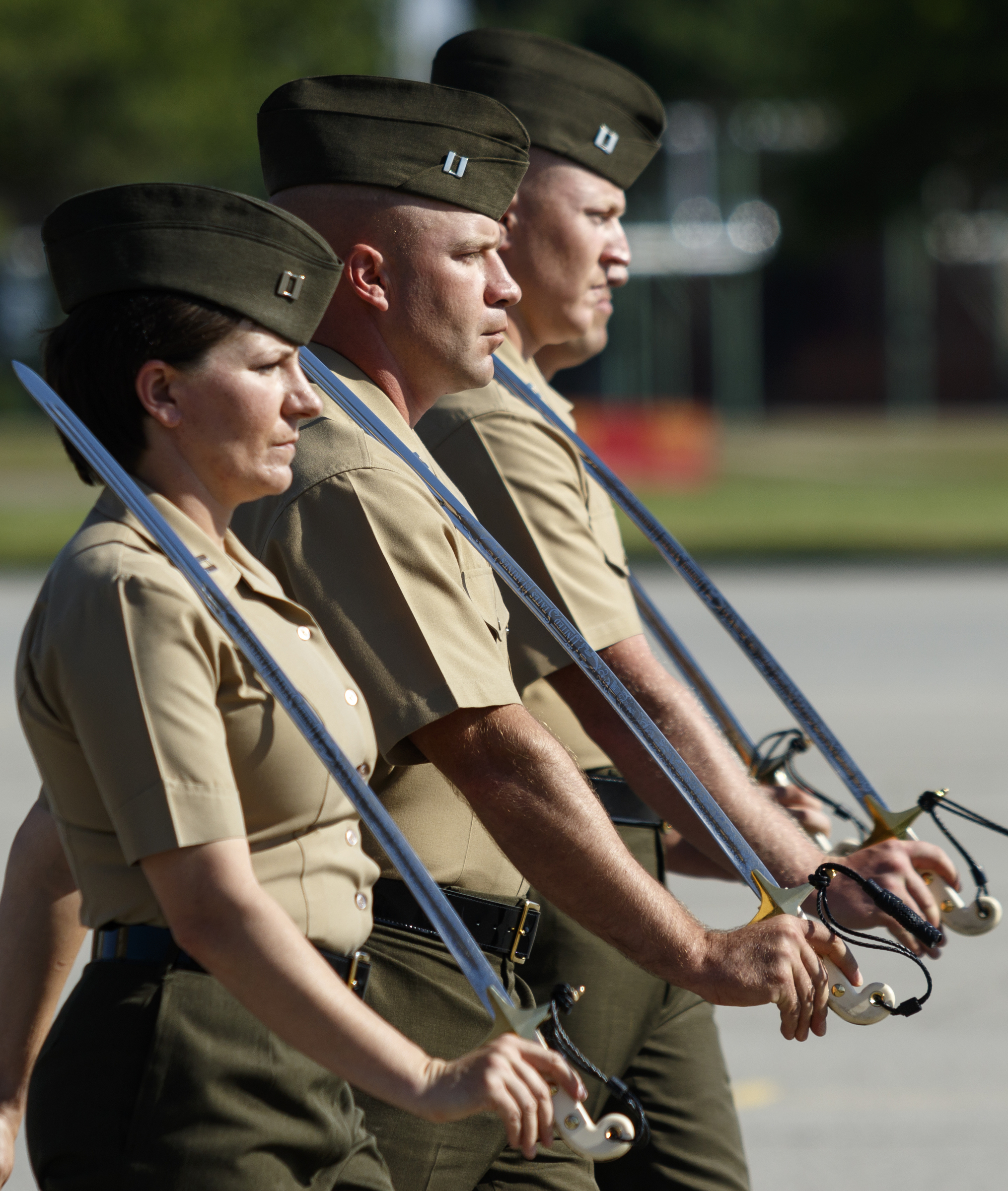 Marine Corps captains march with swords in a graduation ceremony for new Marines at the Marine Corps Recruit Depot on Friday, April 29, 2016, in Parris Island, South Carolina. 379 new Marines graduated from boot camp Friday.