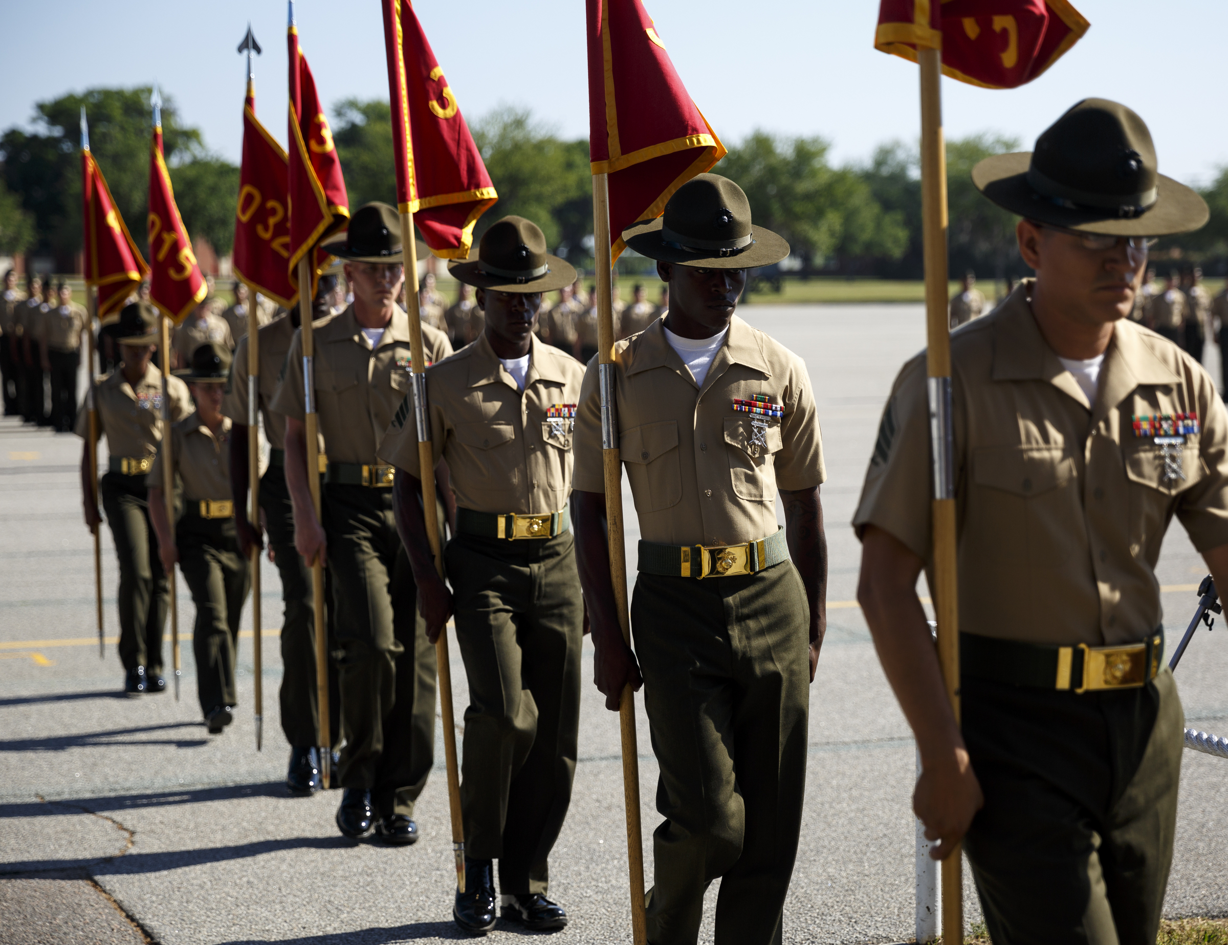 Drill instructors carry away the guidons of the newly graduated Marines' battalions during their graduation ceremony at the Marine Corps Recruit Depot on Friday, April 29, 2016, in Parris Island, South Carolina. 379 new Marines graduated from boot camp Friday.