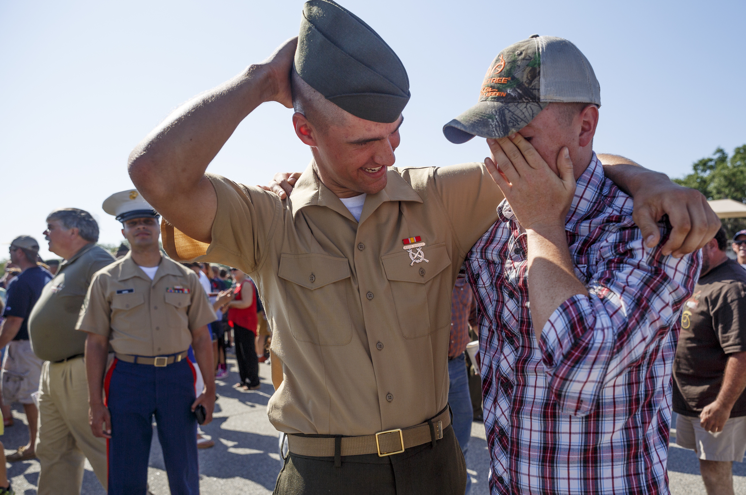 New Marine Pfc. Matthew Madore, left, is greeted by his best friend and fellow Marine Christian Smith after Madore's graduation ceremony at the Marine Corps Recruit Depot on Friday, April 29, 2016, in Parris Island, South Carolina. 379 new Marines graduated from boot camp Friday.