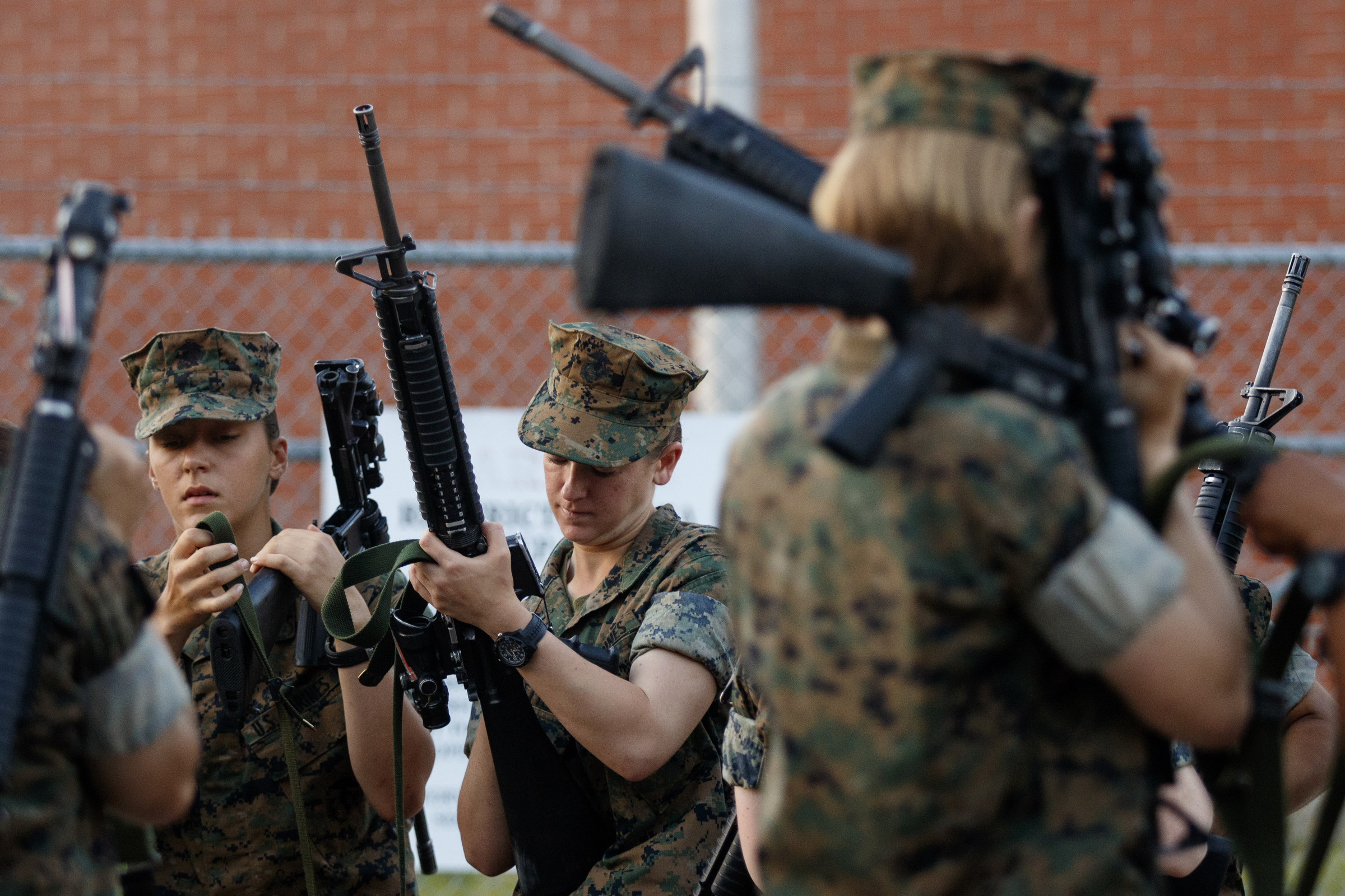 Marine Corps recruits prepare their rifles to be cleaned at the Marine Corps Recruit Depot on Tuesday, April 26, 2016, in Parris Island, South Carolina.