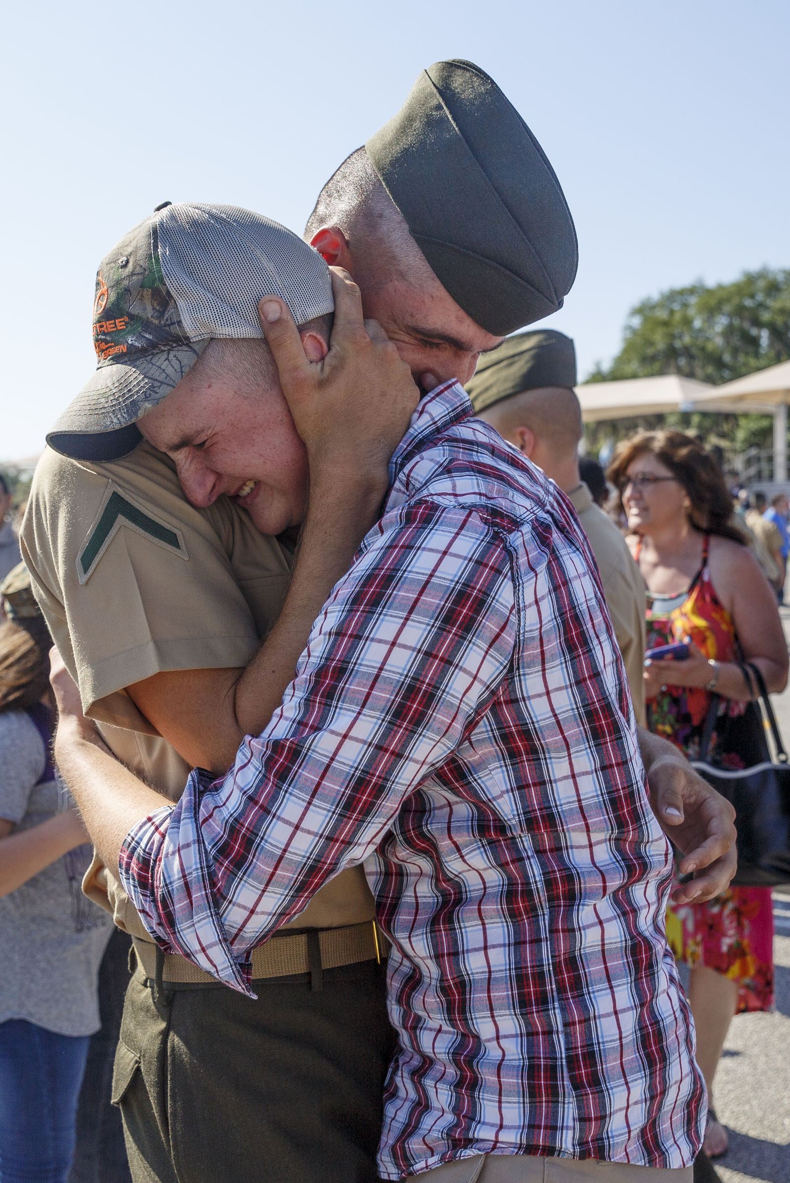 New Marine Pfc. Matthew Madore, left, hugs his best friend and fellow Marine Christian Smith after Madore's graduation ceremony at the Marine Corps Recruit Depot on Friday, April 29, 2016, in Parris Island, South Carolina. 379 new Marines graduated from boot camp Friday.