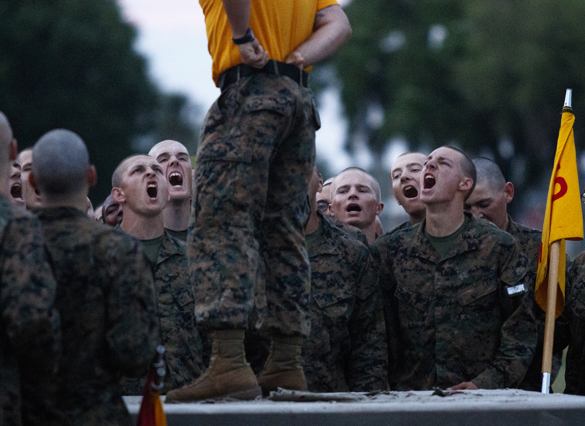 Recruits shout in response to a senior drill instructor during morning PT at the Marine Corps Recruit Depot on Thursday, April 28, 2016, in Parris Island, South Carolina.
