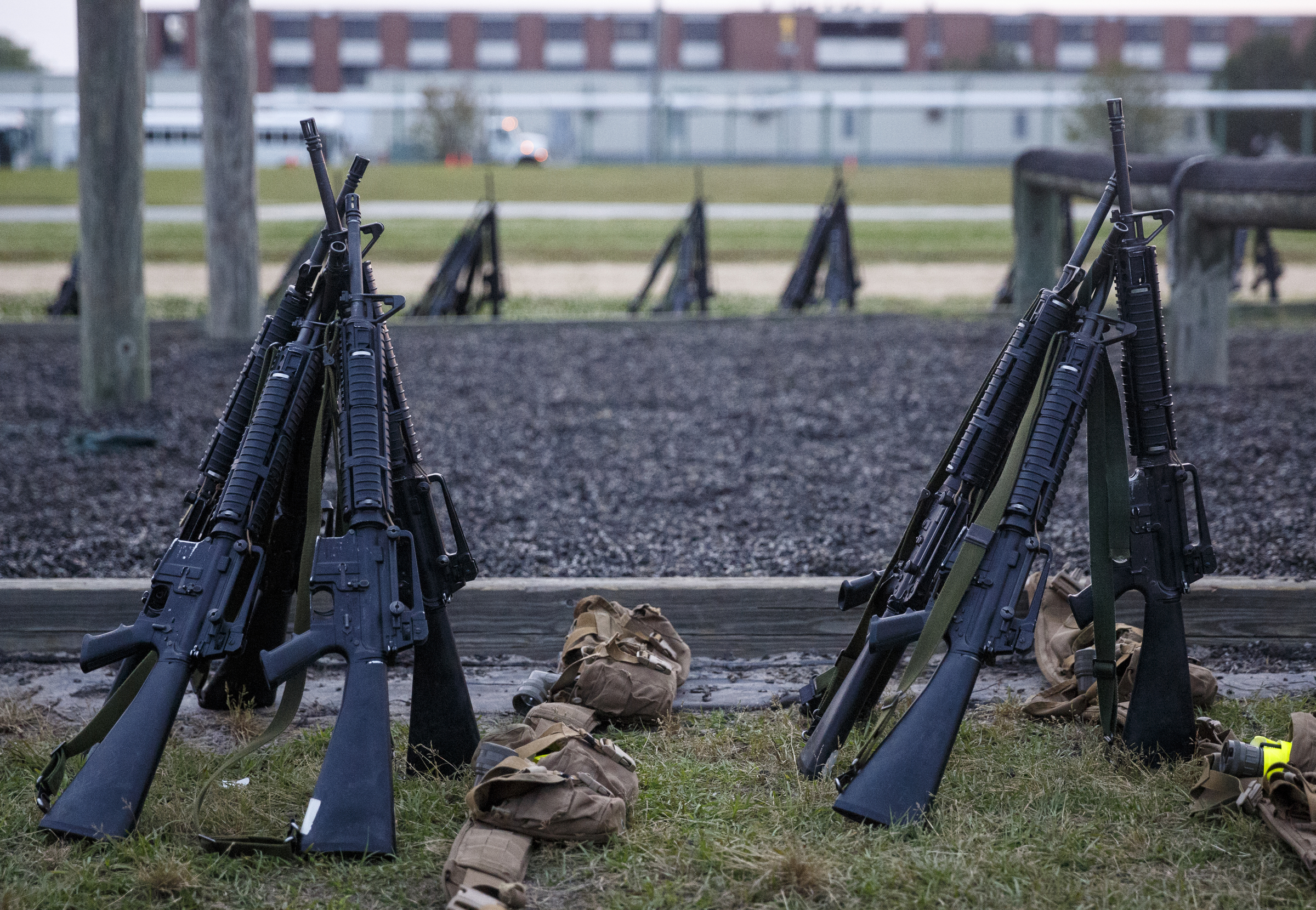 M-16 rifles are stacked nearby as Marines go through morning PT at the Marine Corps Recruit Depot on Thursday, April 28, 2016, in Parris Island, South Carolina.