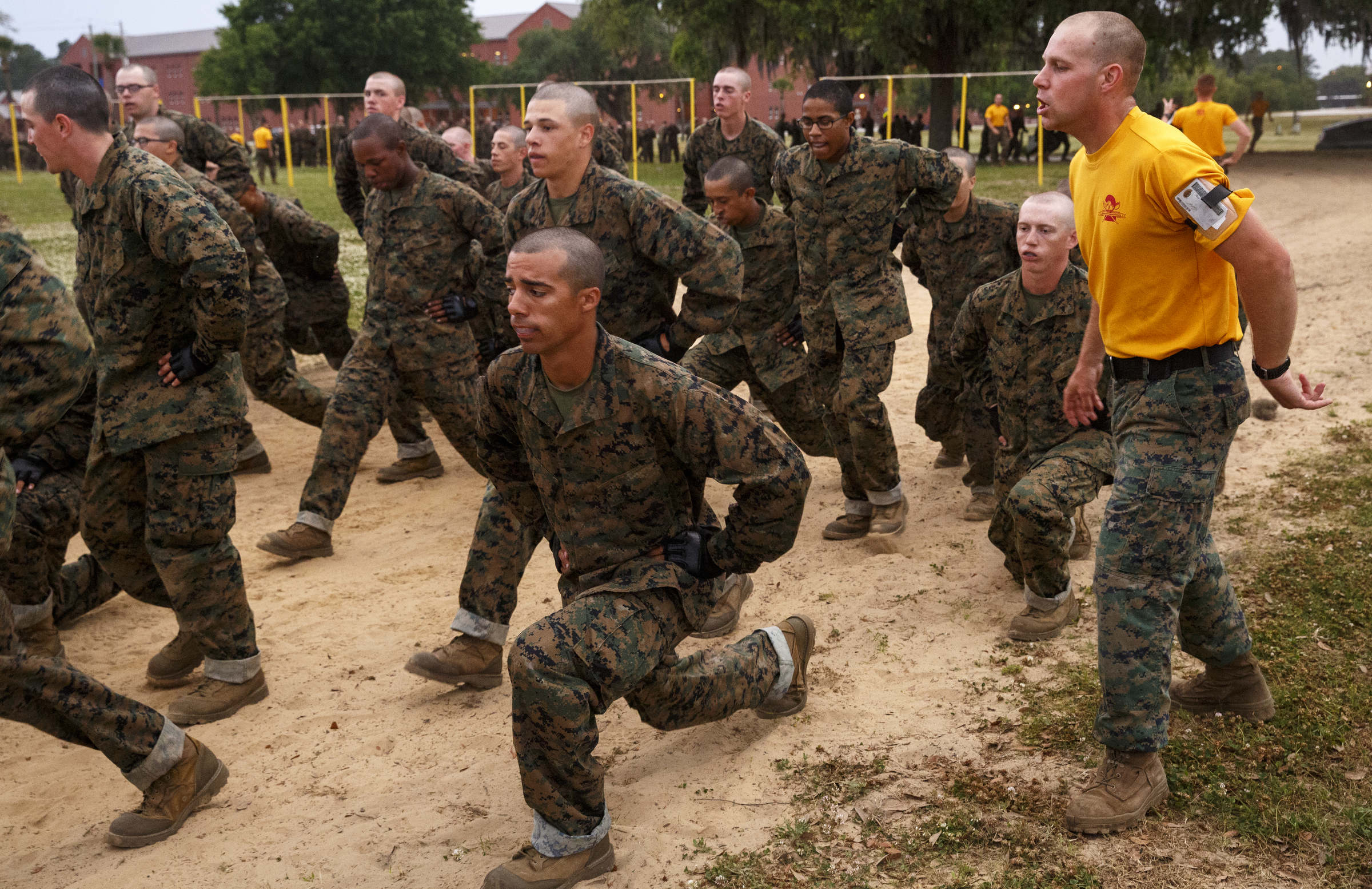 Recruits perform lunges as they go through morning PT at the Marine Corps Recruit Depot on Thursday, April 28, 2016, in Parris Island, South Carolina.