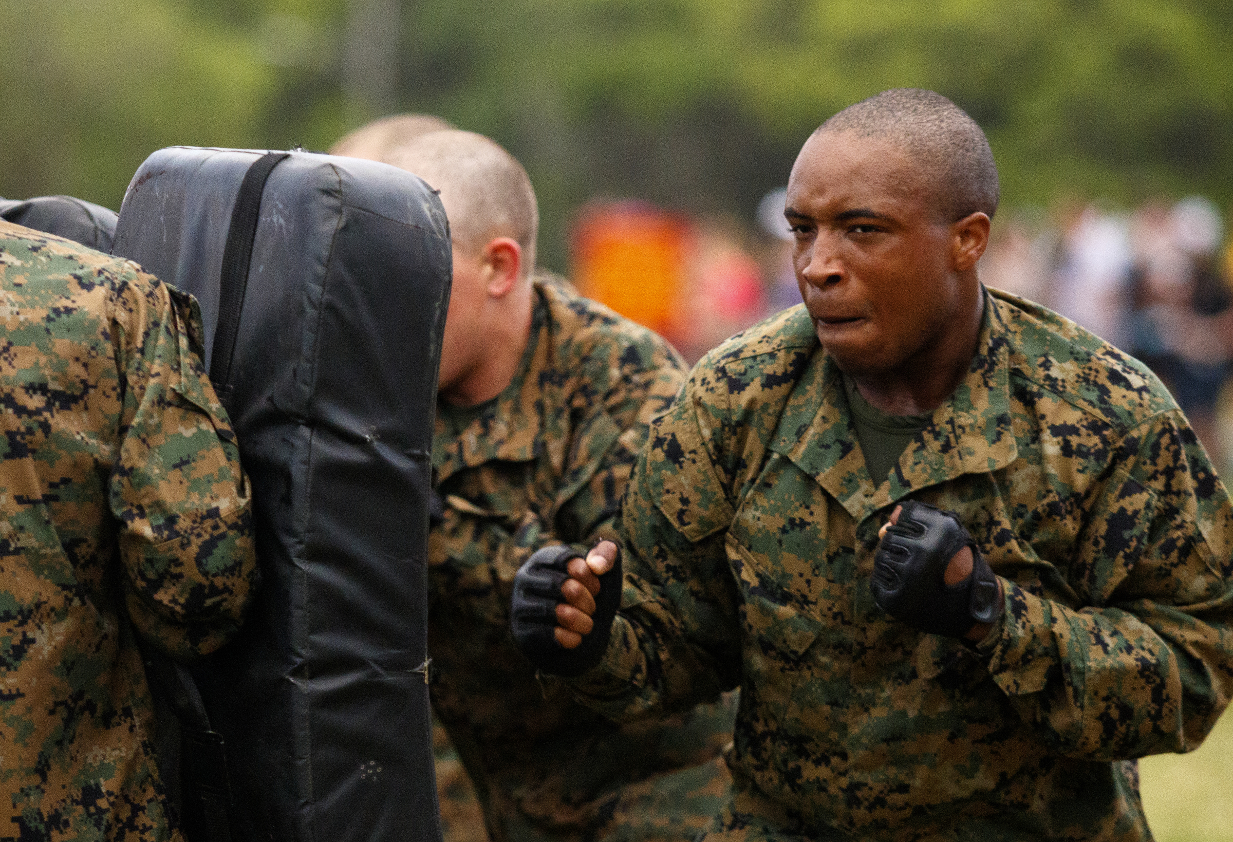 A Marine recruit punches a pad held by another recruit during morning PT at the Marine Corps Recruit Depot on Thursday, April 28, 2016, in Parris Island, South Carolina.