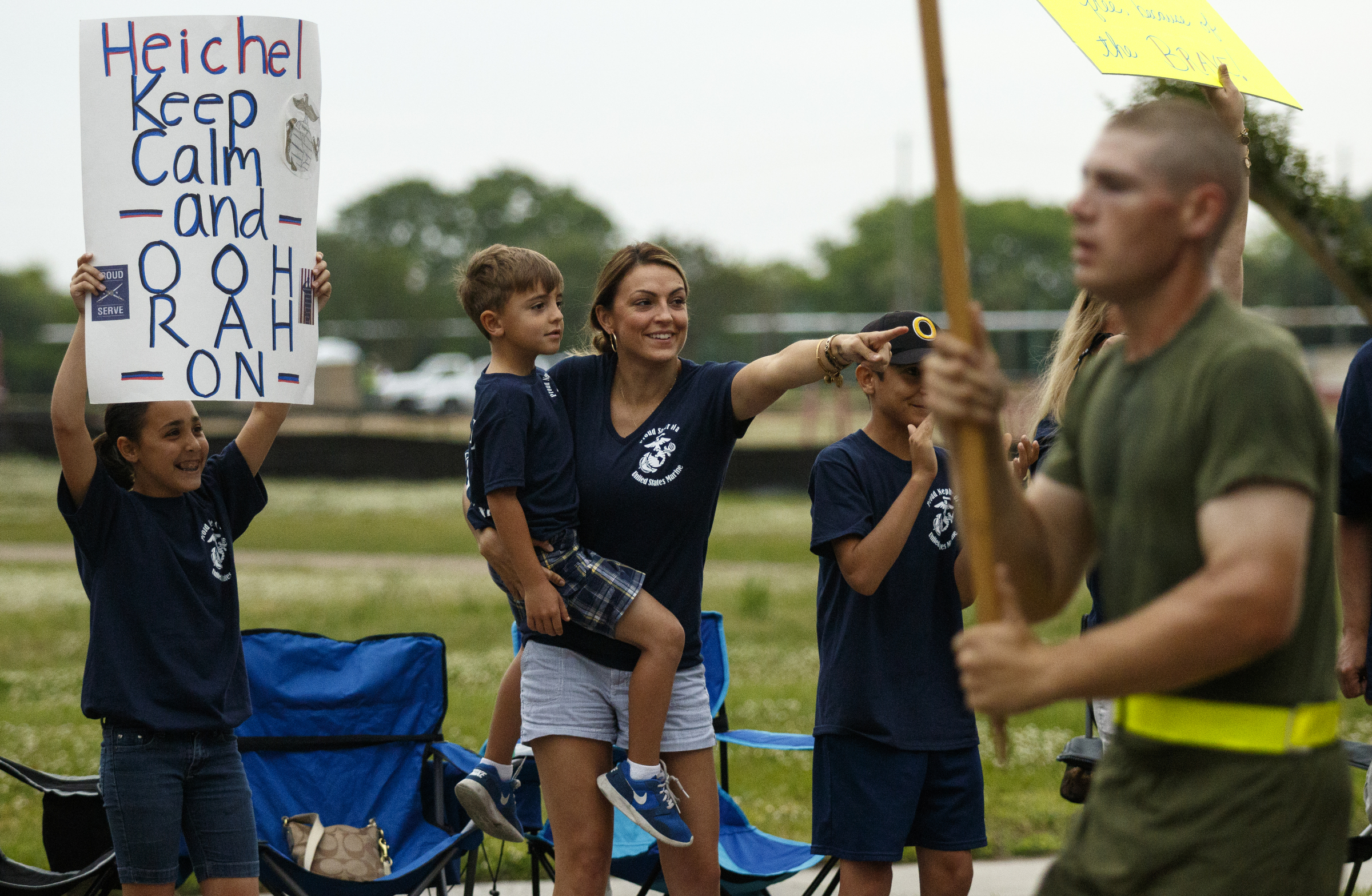 Family members cheer for graduating Marines as they run past on family day at the Marine Corps Recruit Depot on Thursday, April 28, 2016, in Parris Island, South Carolina.