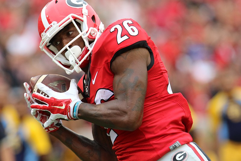 Georgia receiver Malcolm Mitchell, who experienced highs and lows in Athens, was drafted Saturday in the fourth round by the New England Patriots.