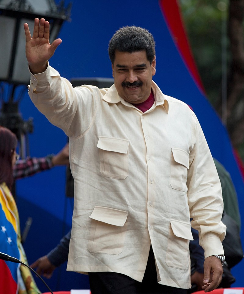 
              File-This April 19, 2016, file photo shows Venezuela’s President Nicolas Maduro greeting supporters upon his arrival to Bolivar Square to celebrate the 206th anniversary of the call for independence from Spain, in Caracas, Venezuela.  The president is ordering a 30 percent increase in the minimum wage, the latest move by the socialist government to grapple with high inflation and economic stagnation. The boost announced Saturday, April 30, 2016, by Maduro comes after a 25 percent increase on March 1. (AP Photo/Fernando Llano, File)
            