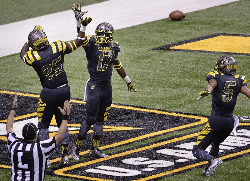 Tyler Byrd, center, celebrates with East teammates Shaquille Quarterman, left, and Demetris Robertson after Byrd returned a PAT for two points during the U.S. Army All-American Bowl in January in San Antonio. The West won the high school all-star game 37-9, with Robertson returning two kickoffs for a total of 84 yards. Robertson, a five-star receiver from Savannah Christian Prep who was recruited by Georgia, announced Sunday that he will play for Cal.