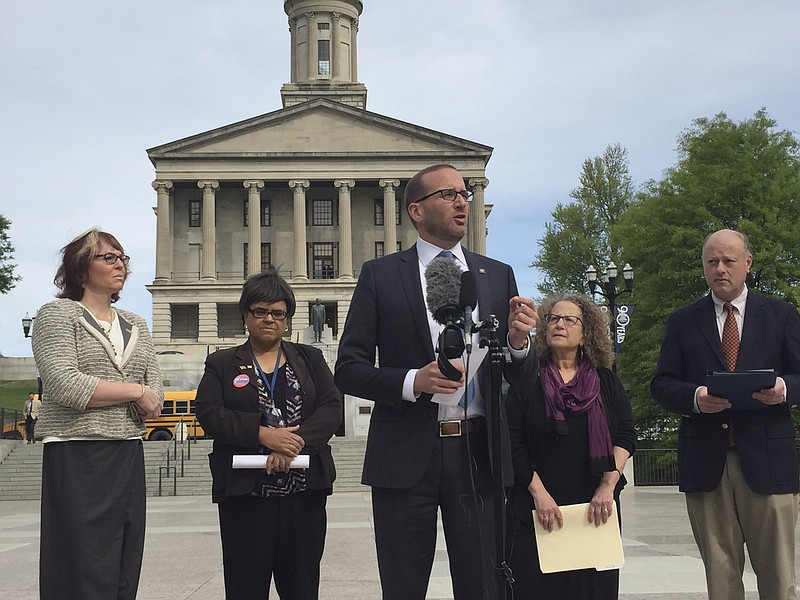 Renee Mclaughlin, senior medical director, Cigna HealthCare; left; Marisa Richmond, lobbyist for the Tennessee Transgender Political Coalition; Chad Griffin, Human Rights Campaign president; Hedy Weinberg; and Chris Sanders, executive director of the Tennessee Equality Project, gather outside the Tennessee Capitol on April 13. Gov. Bill Haslam signed a law allowing therapists to deny treatment to people from "sincerely held" beliefs, which advocates for LGBT people see as legalizing discrimination.