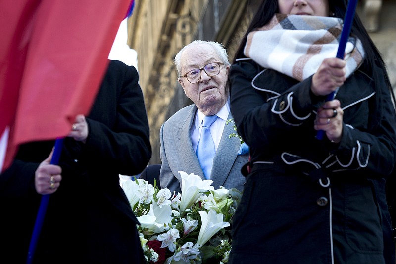 
              Jean-Marie le Pen, former head of the far-right party National Front arrives at the Joan of Arc Statue to deliver a speech, during their annual May Day march, in Paris, France, Sunday, May 1, 2016. French far right leader and presidential hopeful Marine Le Pen is dueling with her father Jean-Marie for public support as the two hold competing events Sunday celebrating Joan of Arc and French glory. (AP Photo/Kamil Zihnioglu)
            