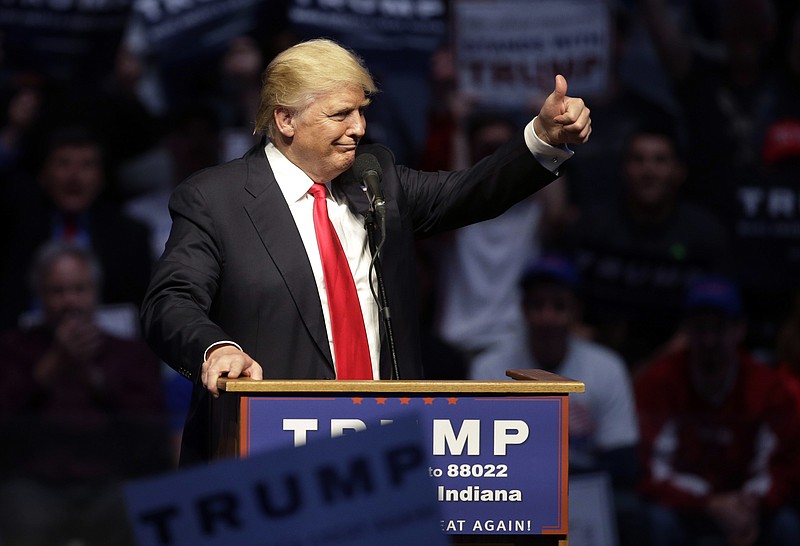 
              FILE - In this April 27, 2016  file photo, Republican presidential candidate Donald Trump gestures during a campaign stop in Indianapolis. Trump has a Plan B on campaign money, and it involves the sort of outside groups that he has called "corrupt." While the political newcomer might lock up the Republican presidential nomination in the next six weeks of voting, he and his allies are simultaneously mounting a public pressure campaign in case he falls short and finds himself at a contested convention this summer in Cleveland. (AP Photo/Darron Cummings, File)
            