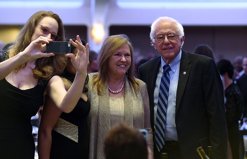 
              Democratic presidential candidate Sen. Bernie Sanders, I-Vt., right and his wife Jane O'Meara Sanders, center, attend the annual White House Correspondents' Association dinner at the Washington Hilton, in Washington, Saturday, April 30, 2016. (AP Photo/Susan Walsh)
            