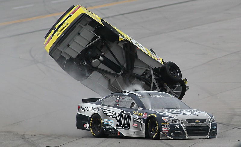 Matt Kenseth's car flips after Danica Patrick (10) crashed into him during the NASCAR Talladega auto race at Talladega Superspeedway, Sunday, May 1, 2016, in Talladega, Ala. (AP Photo/Greg McWilliams)