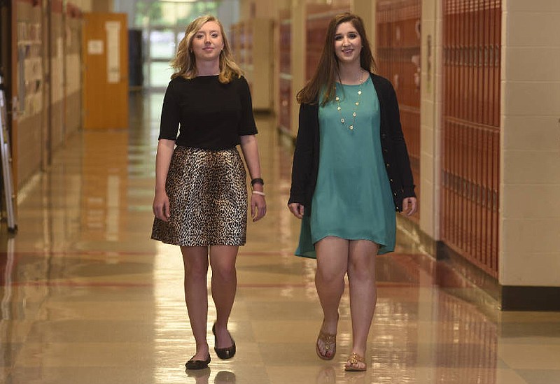 Signal Mountain High School seniors Bethany Burns, left, and Maggie Dowling were born on the same day, have participated in numerous organizations together and now are tied with 4.0 GPAs. Bethany is valedictorian and Maggie is salutatorian for the school's class of 2016.