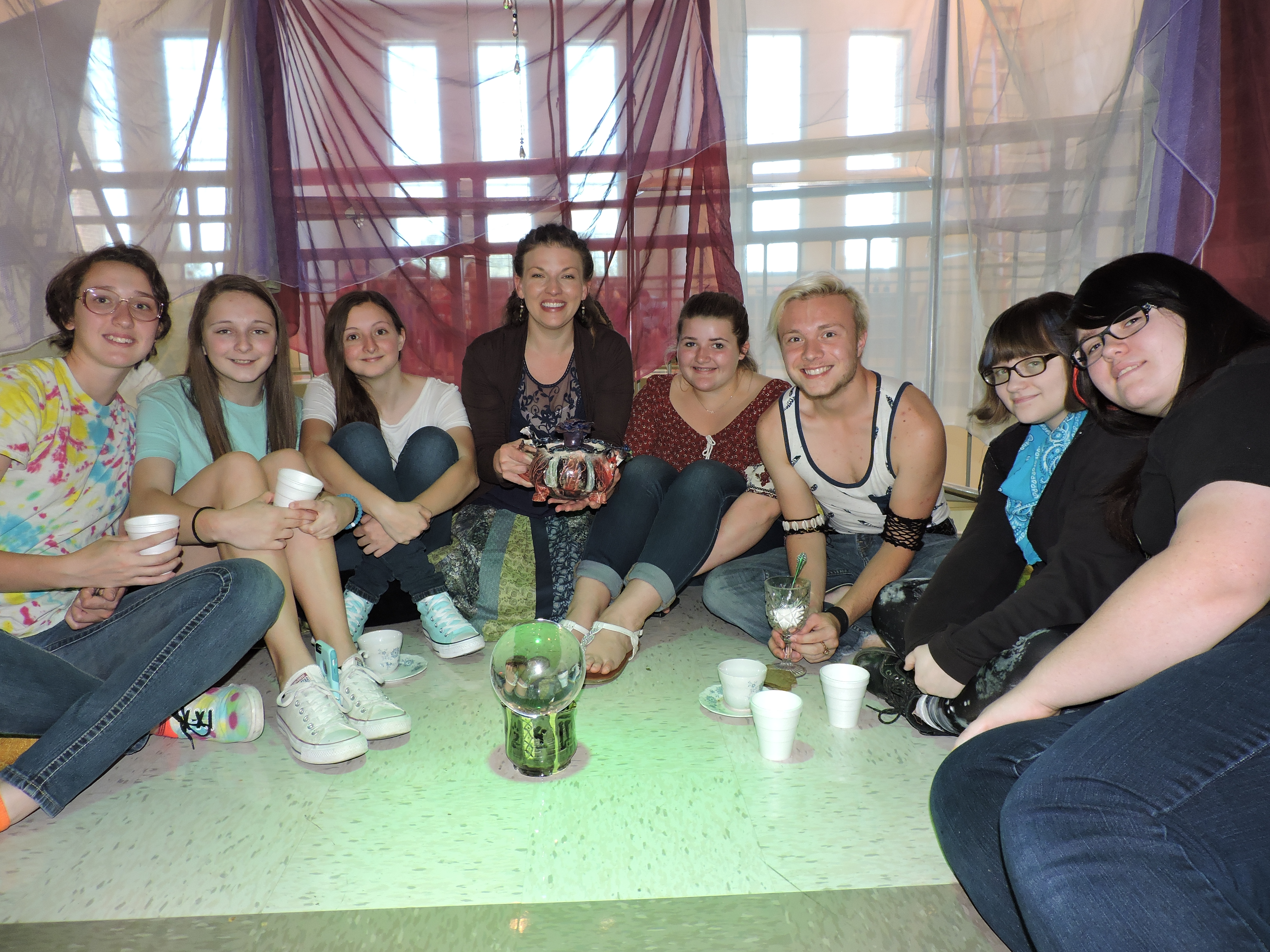 LaFayette High School junior Gabe Hill creates an art installation environment where he pours his own organic blend of hot tea out of a teapot that he created in art class. From left are LHS junior Rachel Graham, Saddle Ridge Middle School eighth-grader Hope McClure, LHS senior Joy McClure, LHS art teacher Heather Hawkins, SRMS eighth-grader Katy Atkins, Gabe, Ridgeland High School junior Haven Gray and LHS junior Amanda Grigo.